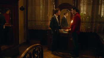 Movie still from “And Then We Danced” (2019), directed by Levan Akin – Two young men are talking in front of a mirror; Wide shot, Over the shoulder angle