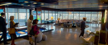 Movie still from “Annie” (2014), directed by Will Gluck – A room filled with lots of furniture and large windows; Wide shot, High angle