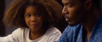 Movie still from “Annie” (2014), directed by Will Gluck – A young girl and an older man sitting next to each other; Close Up shot, Over the shoulder angle