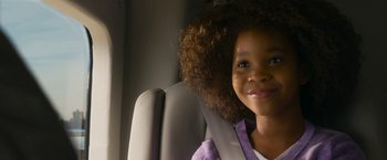 Movie still from “Annie” (2014), directed by Will Gluck – A little girl sitting in the back of a car; Close Up shot, Over the shoulder angle