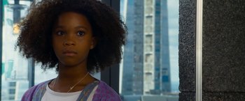 Movie still from “Annie” (2014), directed by Will Gluck – A young girl is standing in front of a window; Close Up shot, Low angle