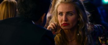 Movie still from “Annie” (2014), directed by Will Gluck – A person holding a pen; Close Up shot, Over the shoulder angle