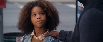 Movie still from “Annie” (2014), directed by Will Gluck – A young girl with her arm around an older person; Close Up shot, Over the shoulder angle