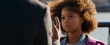 Movie still from “Annie” (2014), directed by Will Gluck – A little girl is holding up her middle finger to a man; Close Up shot, Over the shoulder angle