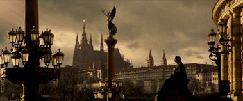 A view of a statue in front of a castle
