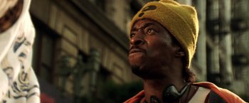 Movie still from “Armageddon” (1998), directed by Michael Bay – A person wearing a hat; Close Up shot, Low angle