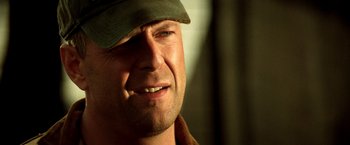 Movie still from “Armageddon” (1998), directed by Michael Bay – A person wearing a hat; Close Up shot, Low angle