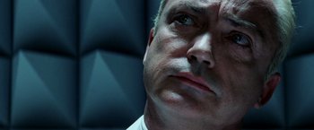 Movie still from “Armageddon” (1998), directed by Michael Bay – A man's face in a dark room; Extreme Close Up shot, Low angle