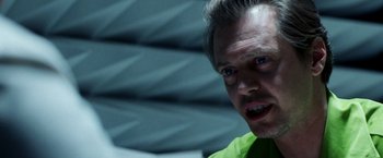 Movie still from “Armageddon” (1998), directed by Michael Bay – A person wearing a green shirt; Close Up shot, Over the shoulder angle