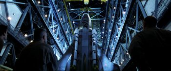 Movie still from “Armageddon” (1998), directed by Michael Bay – An image of a space shuttle in a museum setting; Wide shot, Low angle