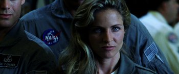 Movie still from “Armageddon” (1998), directed by Michael Bay – A person wearing a uniform; Close Up shot, Over the shoulder angle