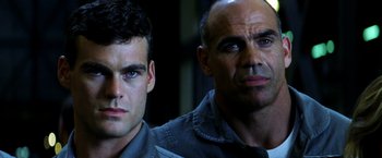 Movie still from “Armageddon” (1998), directed by Michael Bay – A man and a boy are looking at the camera; Close Up shot, Low angle