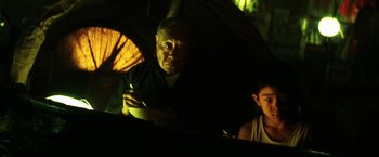 Movie still from “Armageddon” (1998), directed by Michael Bay – A man and a woman under an open umbrella; Medium shot, Over the shoulder angle