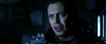 Movie still from “Armageddon” (1998), directed by Michael Bay – A person wearing a helmet; Close Up shot, Over the shoulder angle