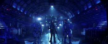 Movie still from “Armageddon” (1998), directed by Michael Bay – A group of people standing next to each other in a tunnel; Wide shot, Low angle