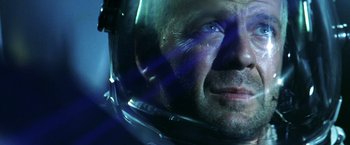 Movie still from “Armageddon” (1998), directed by Michael Bay – A person wearing a helmet; Close Up shot, Low angle
