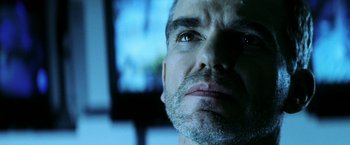 Movie still from “Armageddon” (1998), directed by Michael Bay – A man's face in front of a television; Close Up shot, Low angle