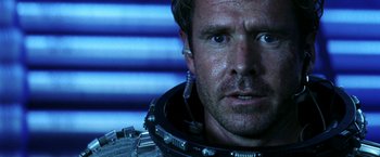 Movie still from “Armageddon” (1998), directed by Michael Bay – A person wearing a space suit; Close Up shot, Over the shoulder angle
