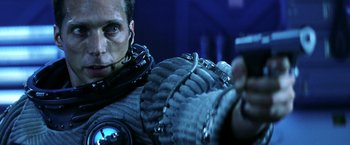 Movie still from “Armageddon” (1998), directed by Michael Bay – A person in a space suit; Close Up shot, Low angle