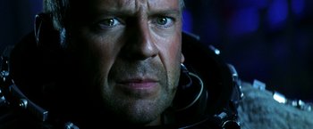 Movie still from “Armageddon” (1998), directed by Michael Bay – A man's face in a space suit; Close Up shot, Low angle