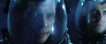 Movie still from “Armageddon” (1998), directed by Michael Bay – A man in a space helmet looking at the camera; Close Up shot, Overhead angle
