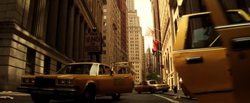 Movie still from “Armageddon” (1998), directed by Michael Bay – A street scene with a taxi cab and a car driving down the street; Extreme Wide shot, Low angle