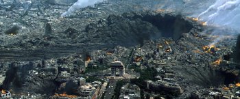 Movie still from “Armageddon” (1998), directed by Michael Bay – An aerial view of a city with a fire in the background; Extreme Wide shot, High angle