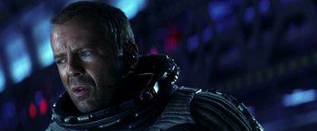 Movie still from “Armageddon” (1998), directed by Michael Bay – A man's face in a helmet; Close Up shot, Over the shoulder angle