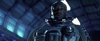 Movie still from “Armageddon” (1998), directed by Michael Bay – A man in a space suit is looking at the camera; Close Up shot, Low angle