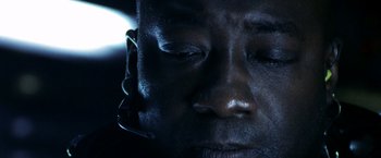 Movie still from “Armageddon” (1998), directed by Michael Bay – A man's face with his eyes closed; Extreme Close Up shot, Overhead angle