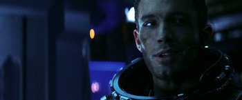 Movie still from “Armageddon” (1998), directed by Michael Bay – A person wearing a space suit; Close Up shot, Low angle