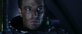 Movie still from “Armageddon” (1998), directed by Michael Bay – A person wearing a helmet; Close Up shot, High angle