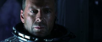 Movie still from “Armageddon” (1998), directed by Michael Bay – A person wearing a space suit; Close Up shot, Overhead angle