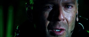 Movie still from “Armageddon” (1998), directed by Michael Bay – A man's face in the dark; Extreme Close Up shot, Low angle