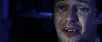 Movie still from “Armageddon” (1998), directed by Michael Bay – A man's face in the dark; Close Up shot, Low angle