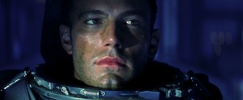 Movie still from “Armageddon” (1998), directed by Michael Bay – A man's face in a space suit; Close Up shot, Low angle