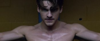 Movie still from “Assassination Nation” (2018), directed by Sam Levinson – A person with a beard; Close Up shot, Over the shoulder angle
