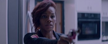 Movie still from “Assassination Nation” (2018), directed by Sam Levinson – A person holding a pair of scissors; Close Up shot, Over the shoulder angle