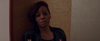 Movie still from “Assassination Nation” (2018), directed by Sam Levinson – A person wearing a black jacket; Close Up shot, High angle