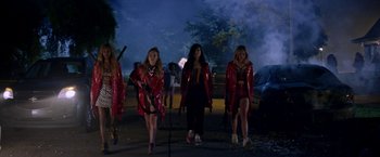 Movie still from “Assassination Nation” (2018), directed by Sam Levinson – A group of women walking on a sidewalk at night; Wide shot, Low angle