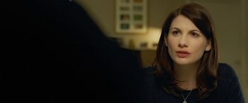 Movie still from “Attack the Block” (2011), directed by Joe Cornish – A person sitting in a room; Close Up shot, Over the shoulder angle