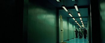 Movie still from “Attack the Block” (2011), directed by Joe Cornish – A hallway with green walls and a white door; Extreme Wide shot, Low angle