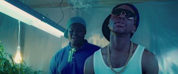 Movie still from “Attack the Block” (2011), directed by Joe Cornish – Two men standing next to each other in a room; Close Up shot, Low angle