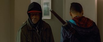 Movie still from “Attack the Block” (2011), directed by Joe Cornish – Two young men standing next to each other; Medium shot, Low angle
