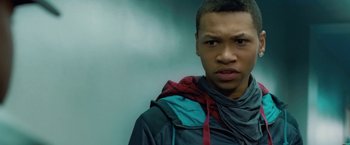 Movie still from “Attack the Block” (2011), directed by Joe Cornish – A young man in a hooded jacket stares at the camera; Close Up shot, Low angle