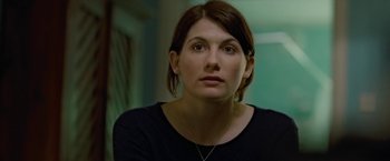 Movie still from “Attack the Block” (2011), directed by Joe Cornish – A person wearing a black shirt; Close Up shot, Over the shoulder angle