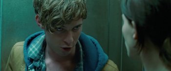 Movie still from “Attack the Block” (2011), directed by Joe Cornish – A person wearing a hooded jacket; Close Up shot, Low angle