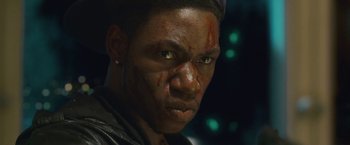 Movie still from “Attack the Block” (2011), directed by Joe Cornish – A person with blood all over his face; Close Up shot, Low angle