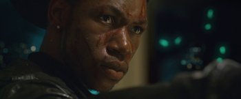 Movie still from “Attack the Block” (2011), directed by Joe Cornish – A man's face covered in blood; Close Up shot, Low angle