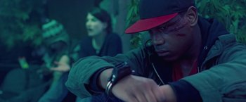 Movie still from “Attack the Block” (2011), directed by Joe Cornish – A man wearing a red hat and a woman wearing a black jacket; Close Up shot, Over the shoulder angle